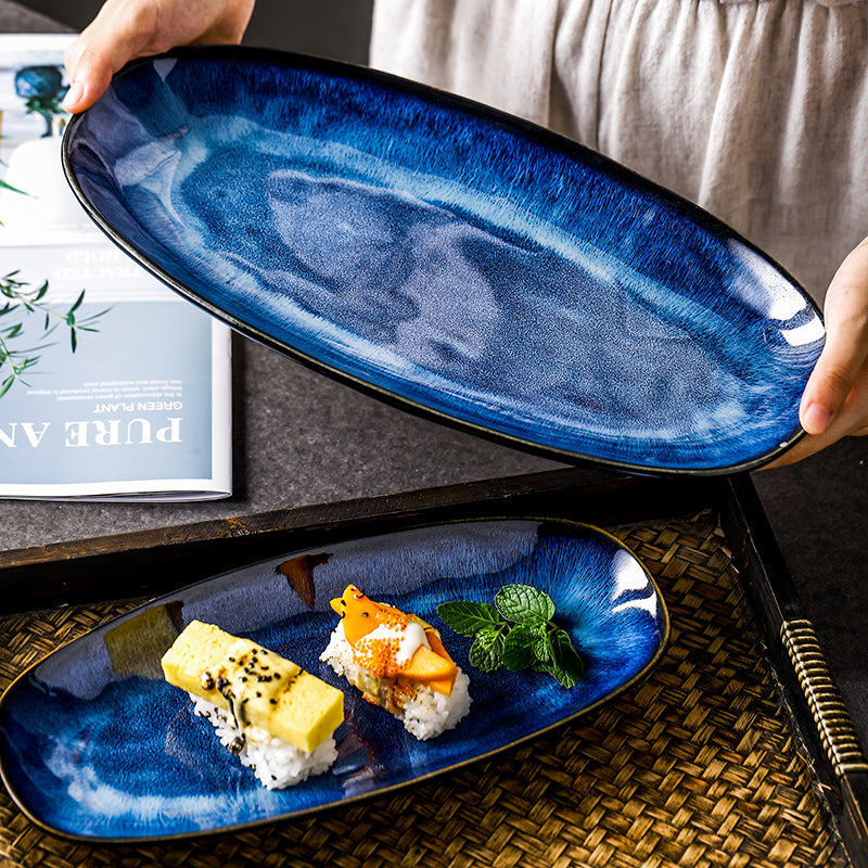 http://platesandcutlery.com/cdn/shop/products/all_images0KINGLANG-Japanese-style-kiln-cat-eye-blue-fish-plate-household-steamed-fish-plate-large-glaze-color.jpg?v=1648657897