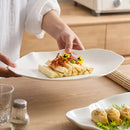 White Oval Wavy-Edge Ceramic Plate for Elegant Serving